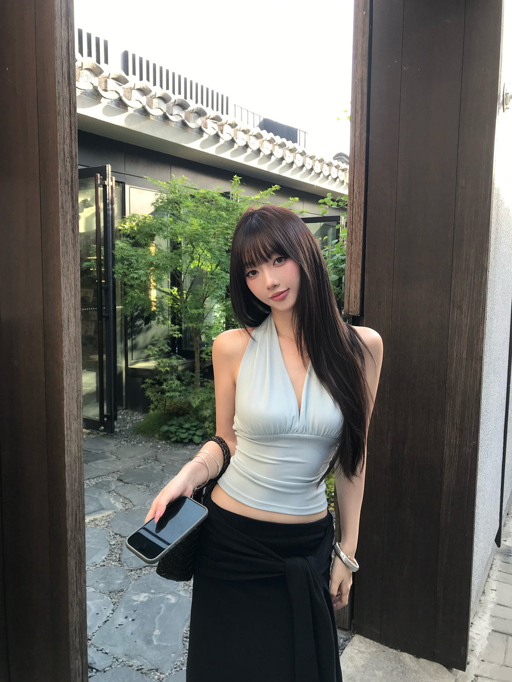 Light blue backless top with waist-cinching design