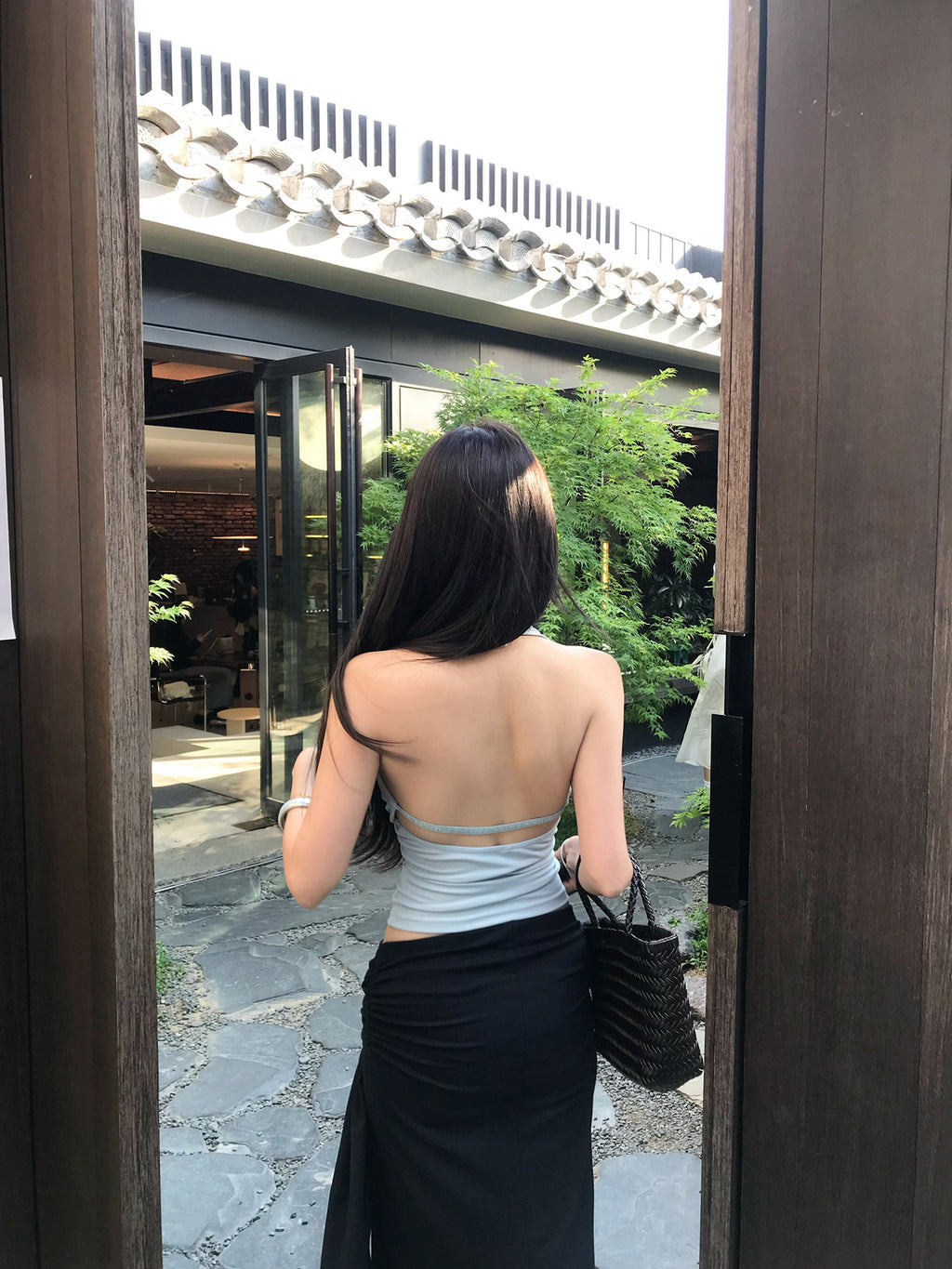 Light blue backless top with waist-cinching design
