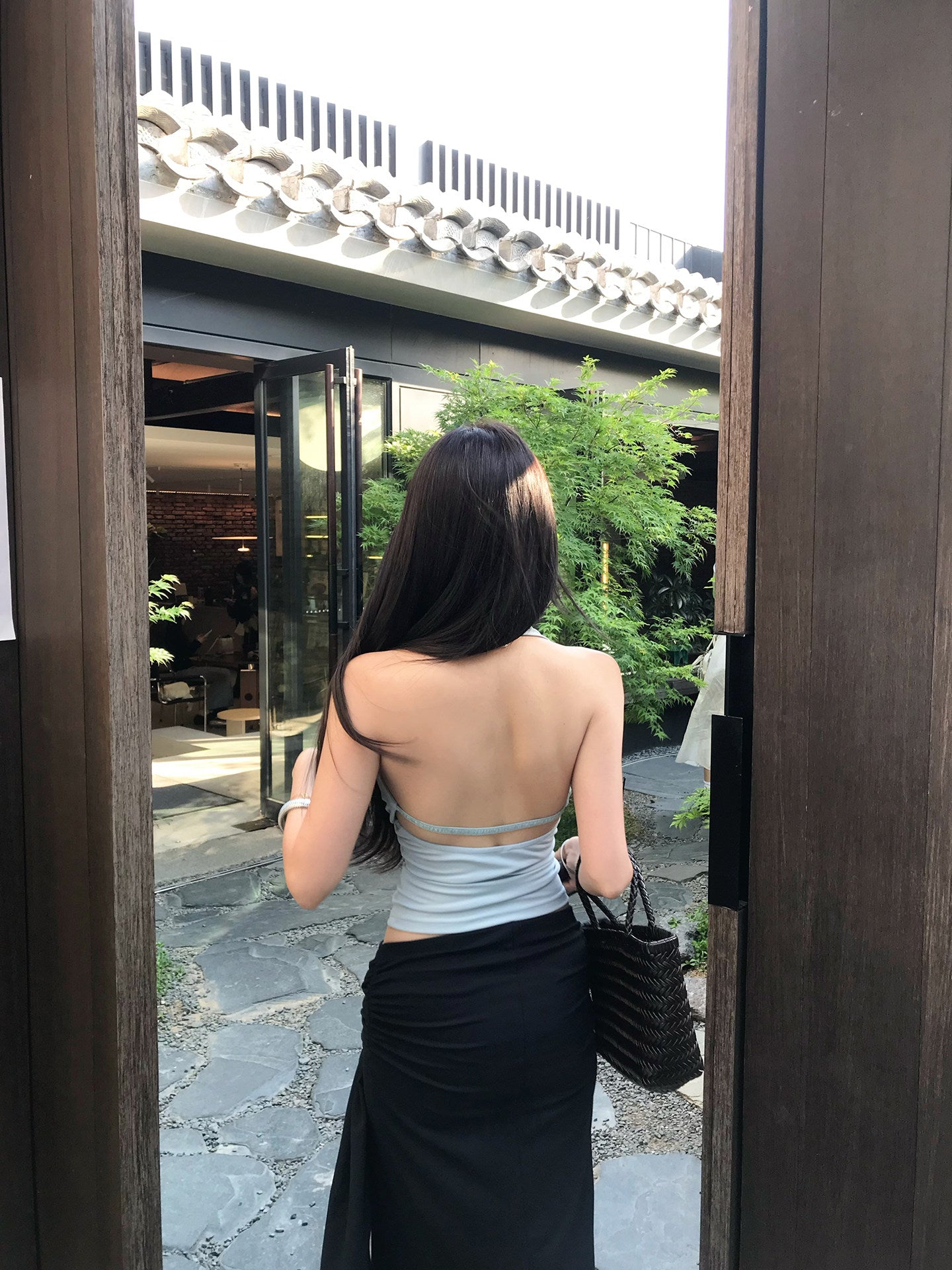 Light blue backless top with waist-cinching design