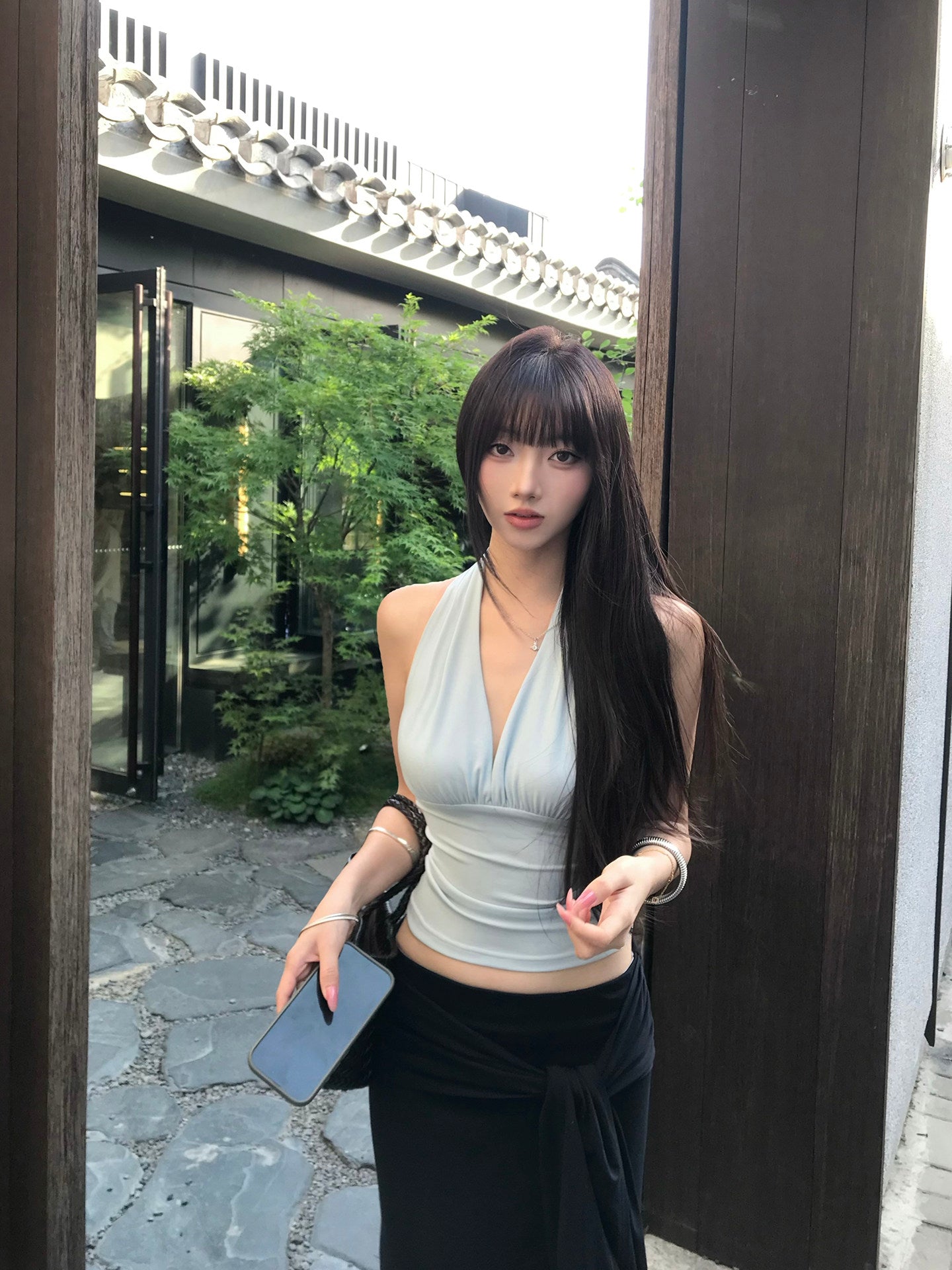 Light blue backless top with waist-cinching design